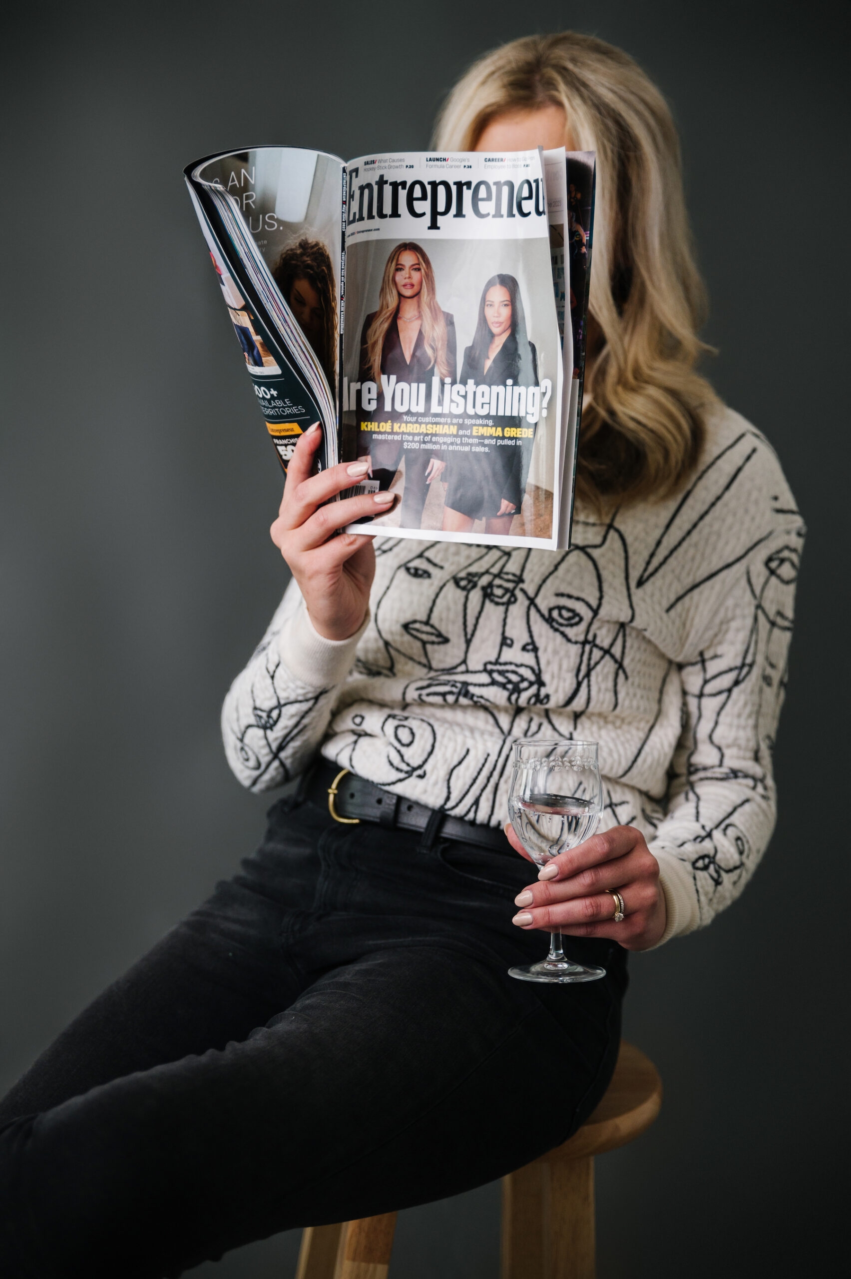 Sarah Klongerbo reading Entrepreneur magazine, representing the "5 Product Page Tips to Boost Your Ecommerce Conversion Rate" blog post