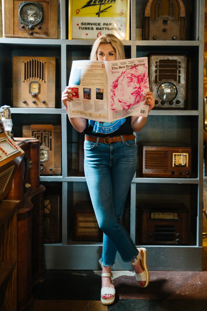 Sarah Klongerbo reading a newspaper, illustrating reading website copy search results
