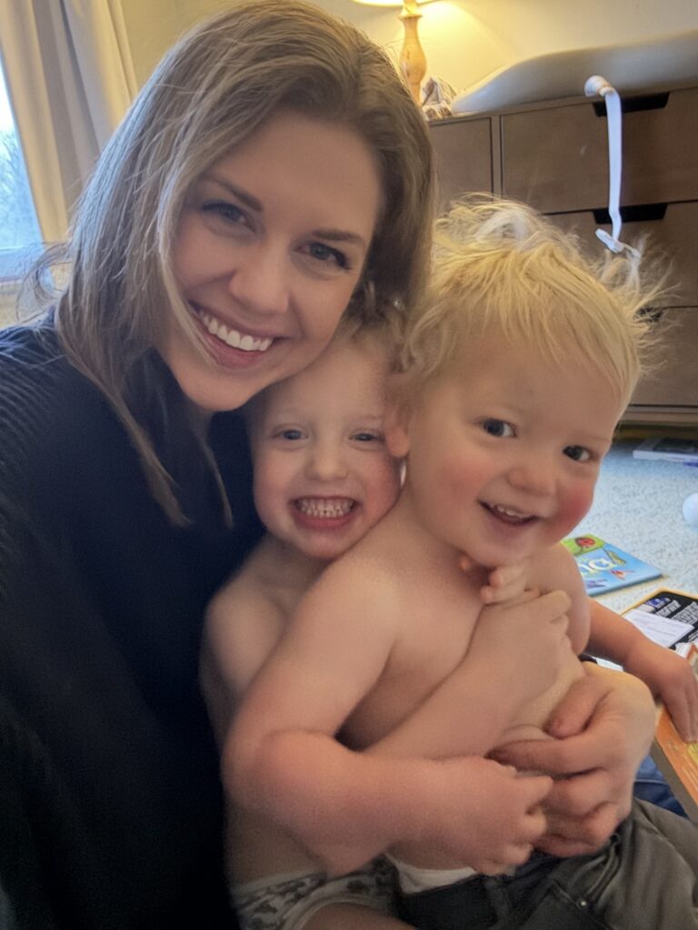 Sarah Klongerbo, a mom entrepreneur, plays with her two children