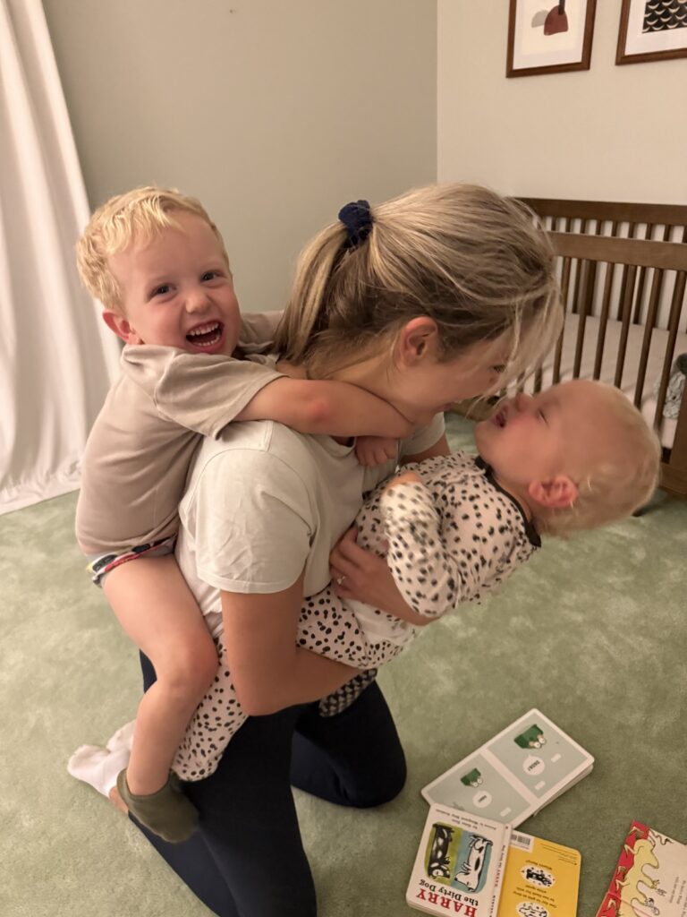 Sarah Klongerbo, a mom business owner, plays with her two children