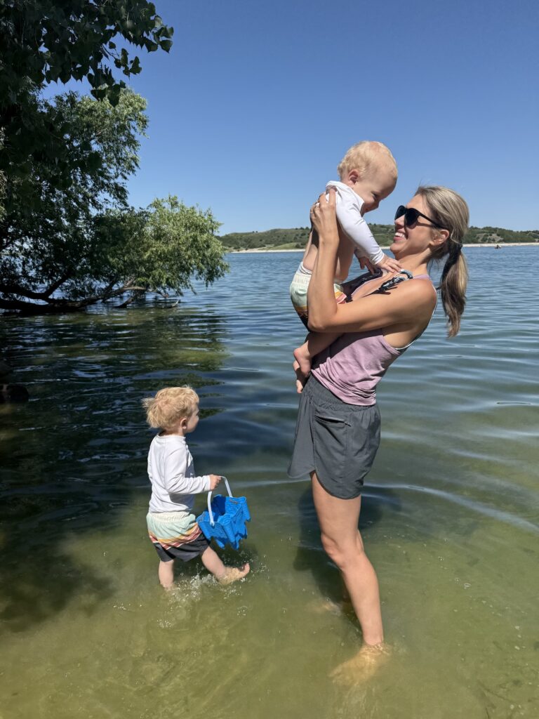 Sarah Klongerbo, a mompreneur, playing with her boys in the water