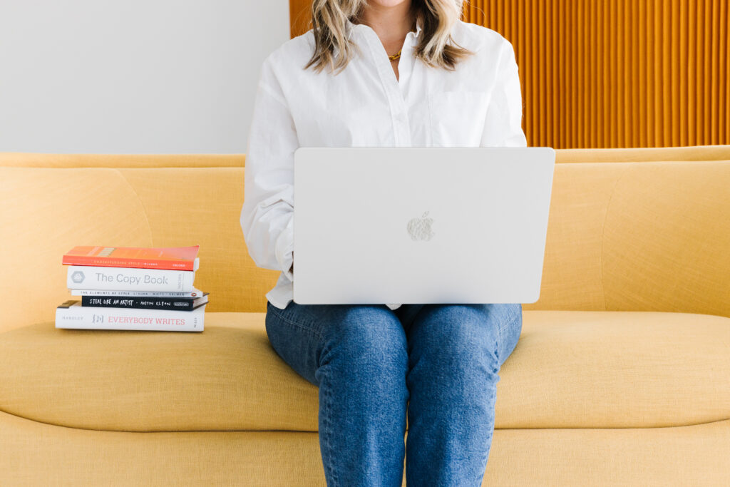 Sarah Klongerbo on her laptop, reading the difference between transactional emails vs. marketing emails